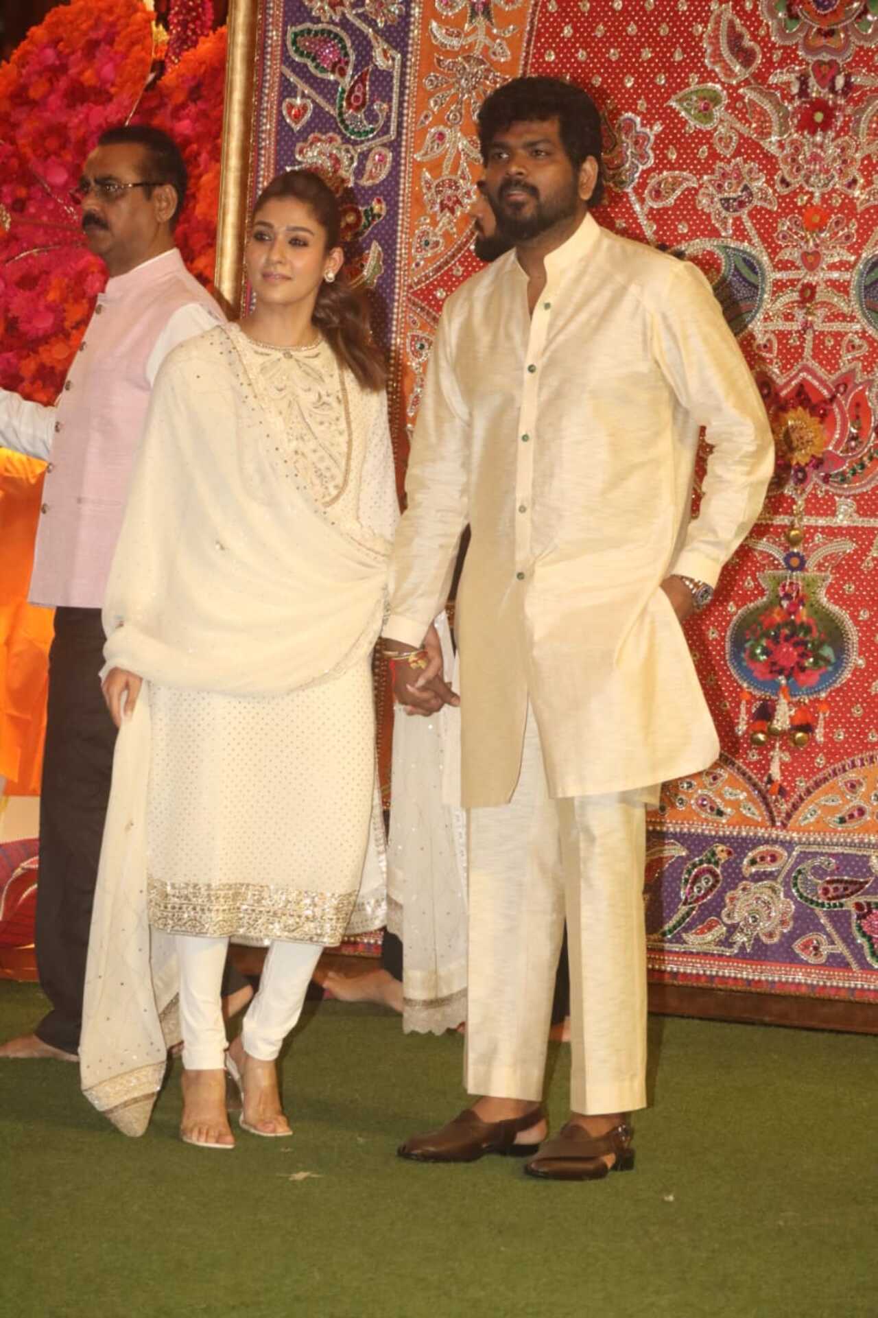 Nayanthara and Vignesh Shivan flew down to Mumbai to attend the Ambanis' Ganesh Puja. They were twinning in ivory-coloured outfits